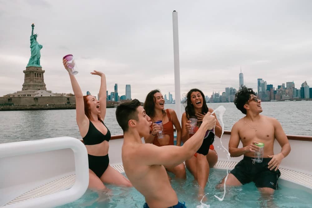 Group celebrating on a NYC hot tub boat