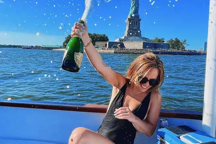 Champagne celebration at the Statue of Liberty on a hot tub boat
