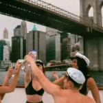 birthday group cheers on hot tub boat in NYC