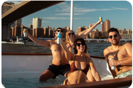 a group of people sitting on a boat in the water