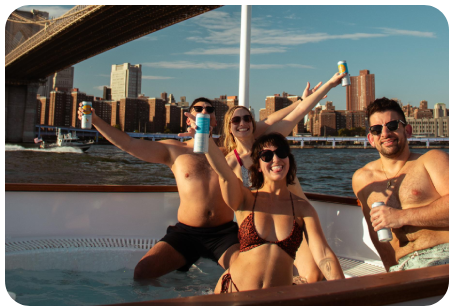 a group of people sitting on a boat in the water