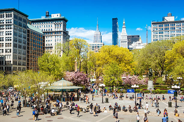 a group of people walking on Union Square, Manhattan street