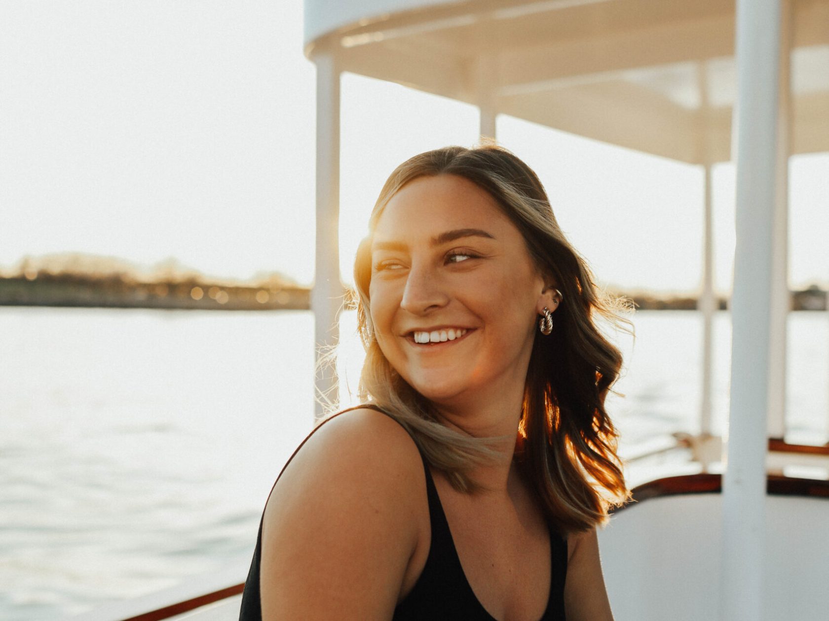 woman smiling on NYC hot tub boat