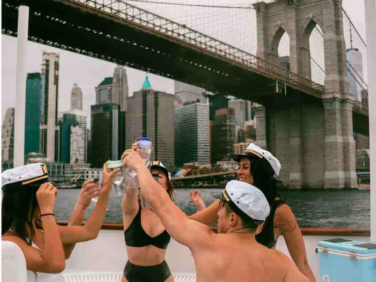 a woman drinking water in a city