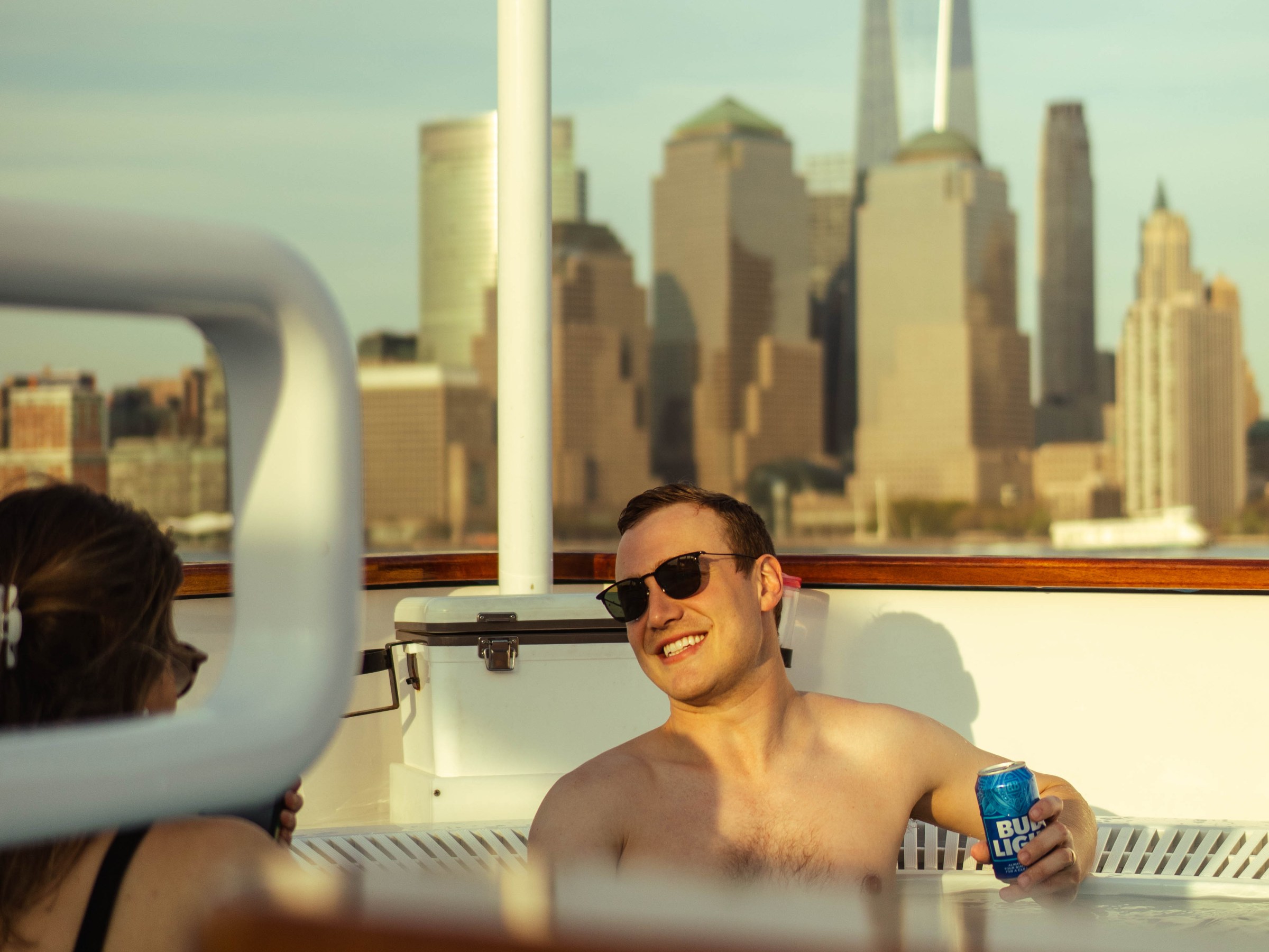 a boat on the water in front of a mirror posing for the camera