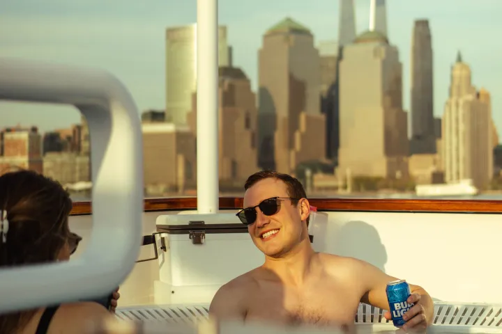 a boat on the water in front of a mirror posing for the camera
