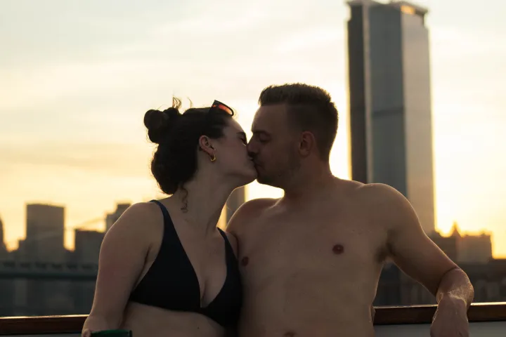 a man and a woman sitting on a bench