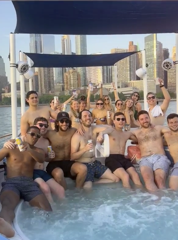 a group of people in the NYC Hot Tub Boat