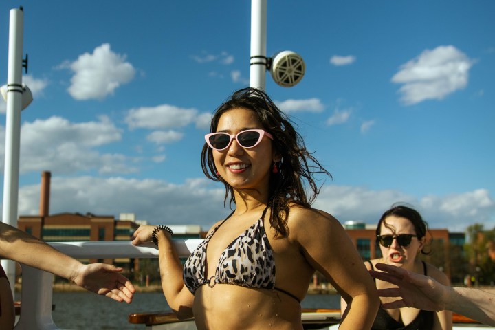 a person sitting next to a body of water