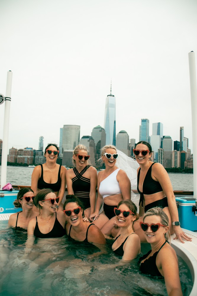 group of friends in hot tub boat in NYC