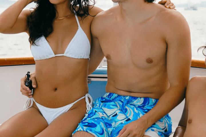 a couple of people that are standing in a pool of water